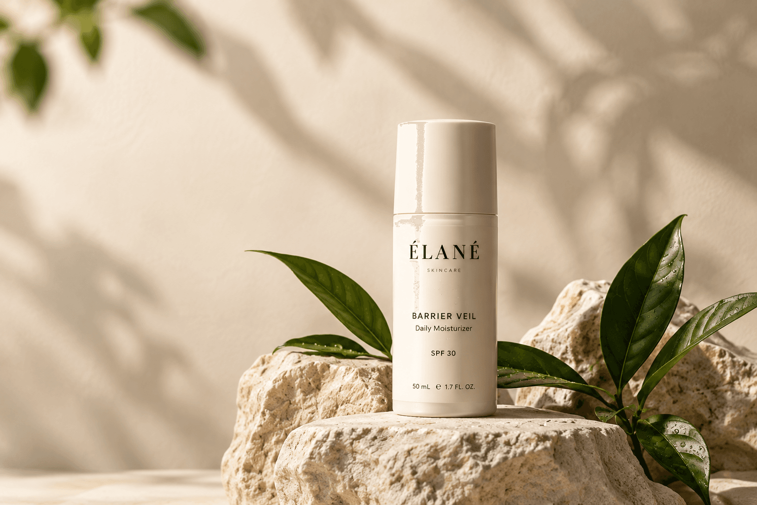 Barrier Veil daily moisturizer styled with stone and leaves